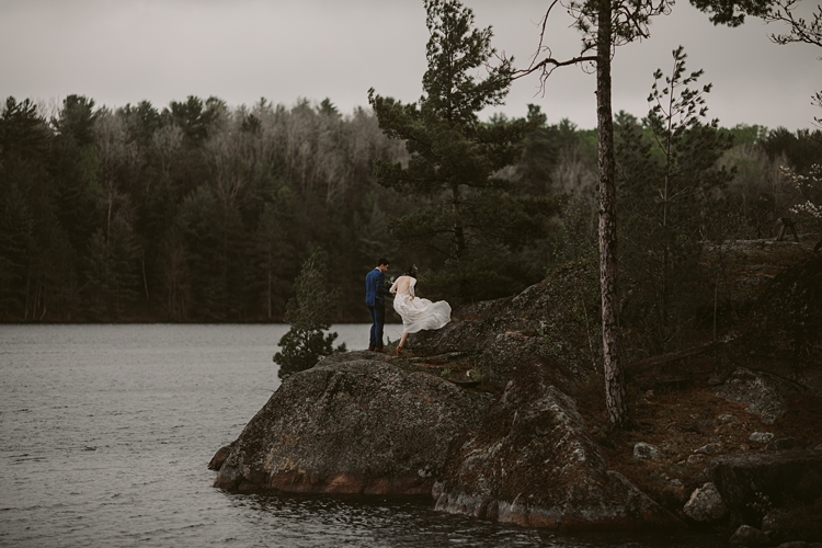 Couple walking up mountain after their elopement