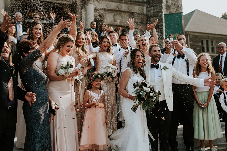 Toronto couple cheers with family and friends outside of church