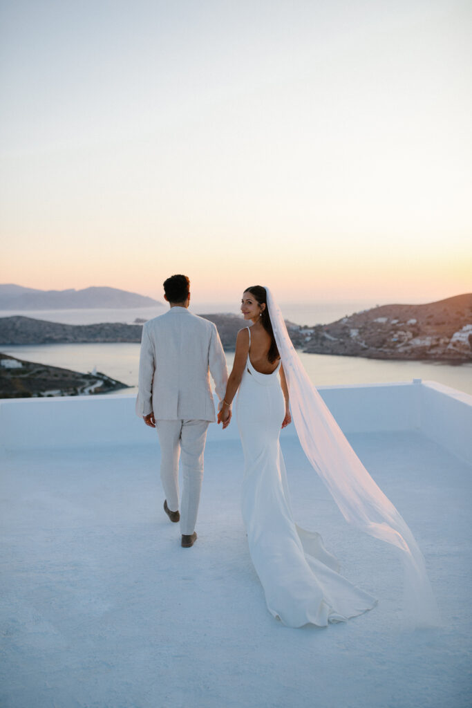 Bride and groom sunset rooftop wedding in Ios Greece